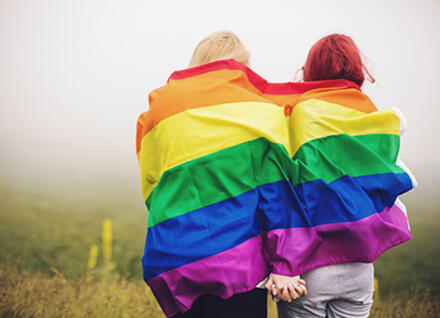 LGBT couple with rainbow flag