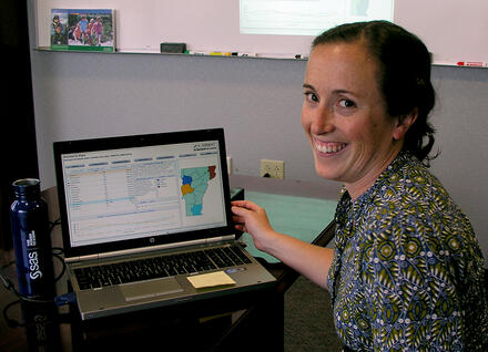 Vermont researcher at a computer