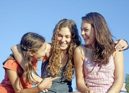 three teen girls smiling three teen girls smiling