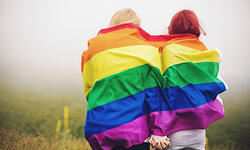 LGBT couple with rainbow flag