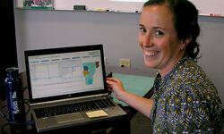 Vermont researcher at a computer