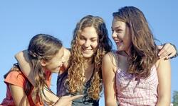 three teen girls smiling three teen girls smiling