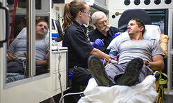 Vermont EMS responders with patient and ambulance Vermont EMS responders with patient and ambulance