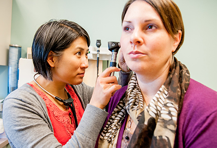 Vermont health professional with patient