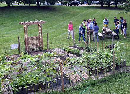 garden, and people around picnic table
