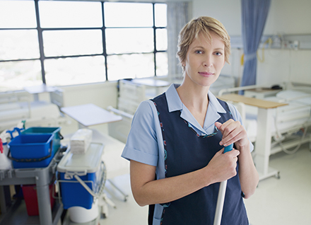 Housekeeping staff cleaning hospital room.