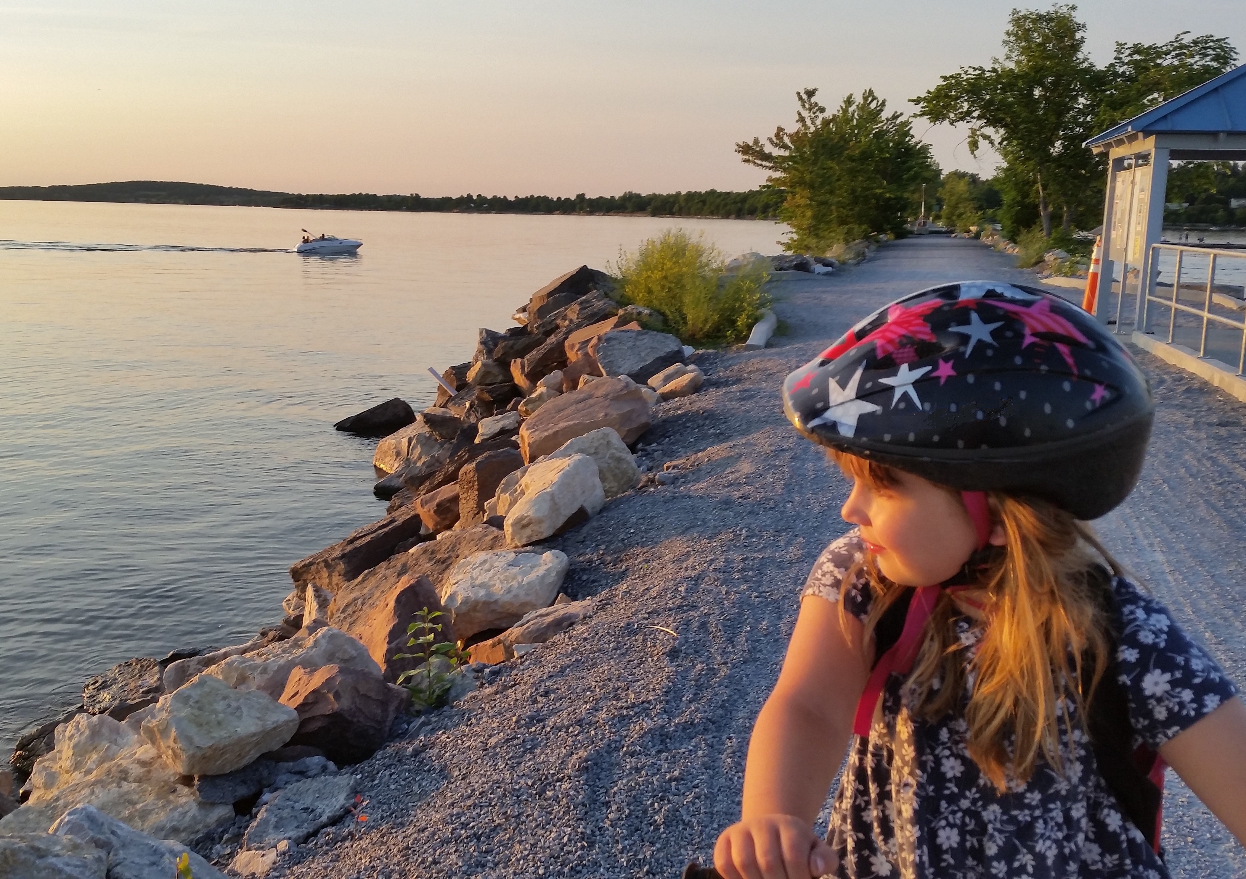 girl on bike near lake