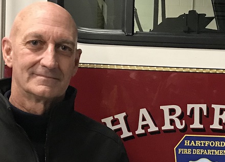 Town Health Officer for Hartford beside fire truck