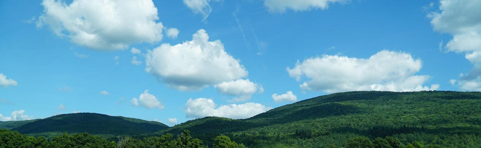 Green Mountains with clouds in the sky