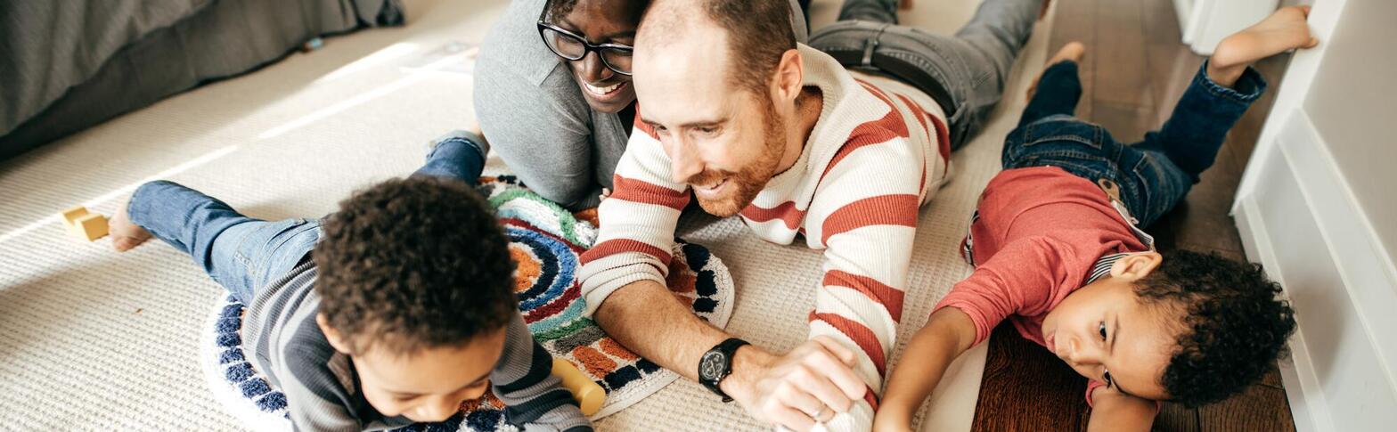 family playing on the floor