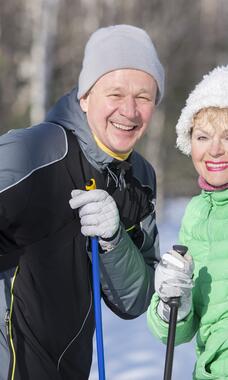 older cross-country skiers, smiling