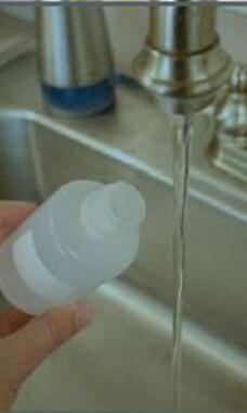 bottle at sink to get water sample