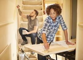 man and woman painting