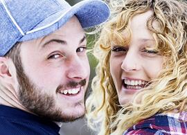 two young people, smiling