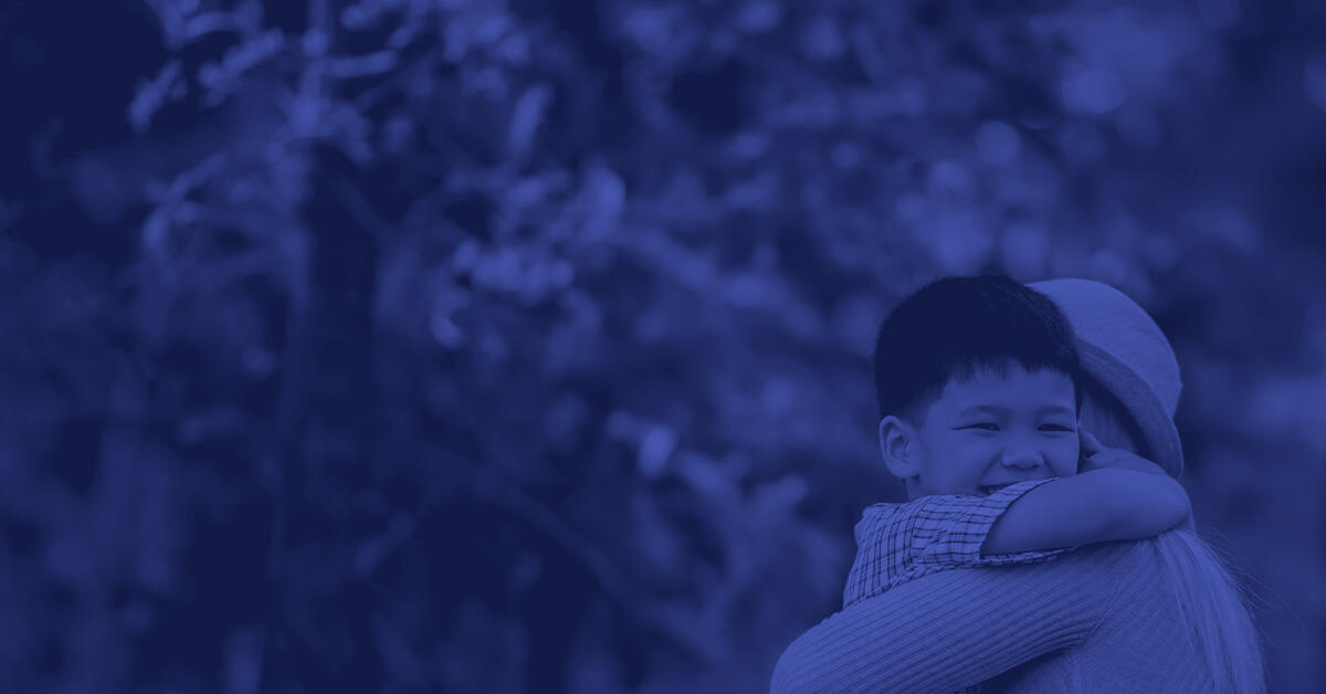 Child hugging their parent.