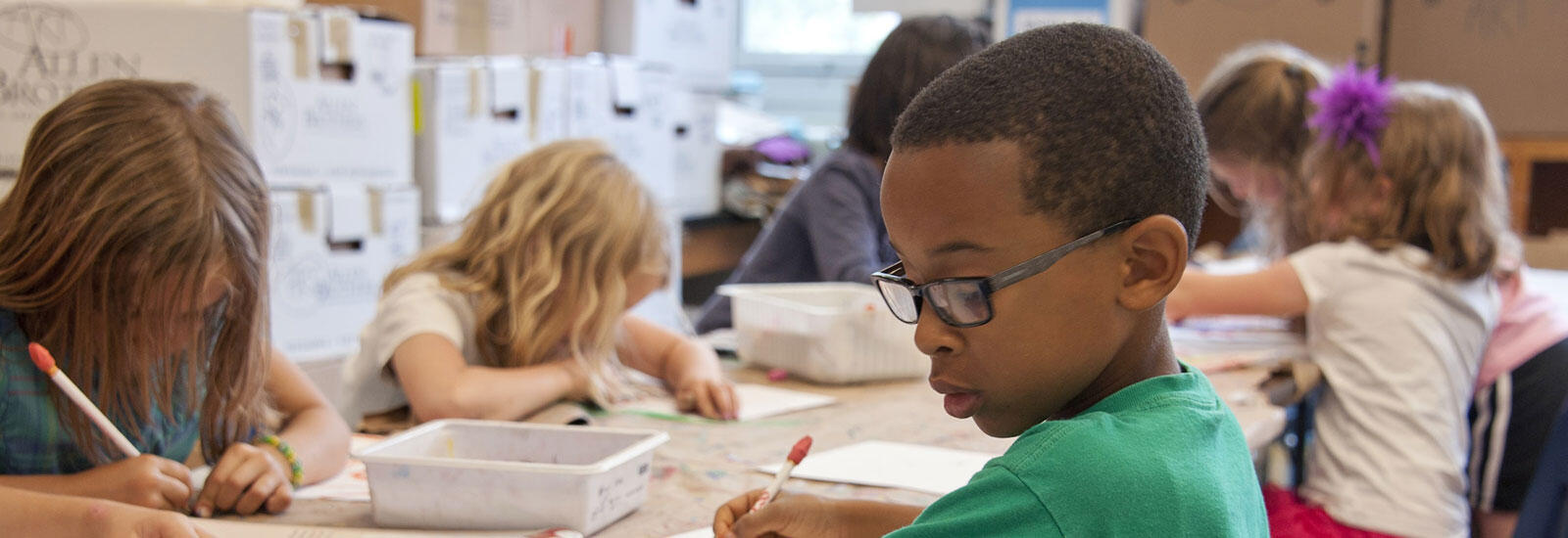 children doing school work in a classroom