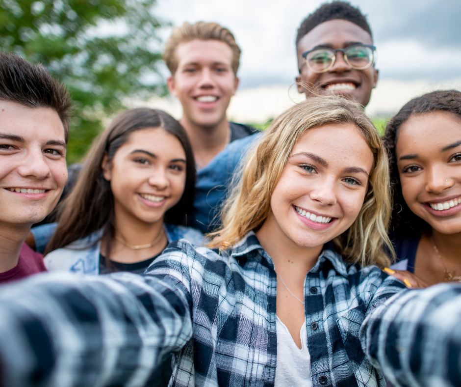 Group of diverse teens taking a selfie