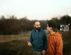 teen and man walking, talking