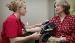 Nurse taking patients blood pressure