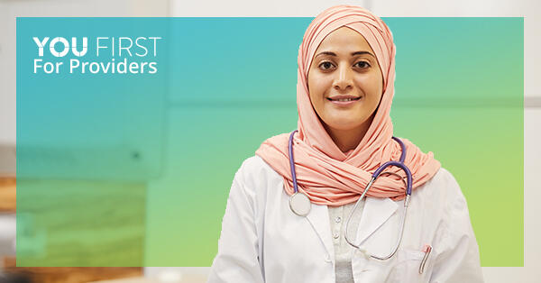 Doctor wearing stethoscope and head covering, with You First logo