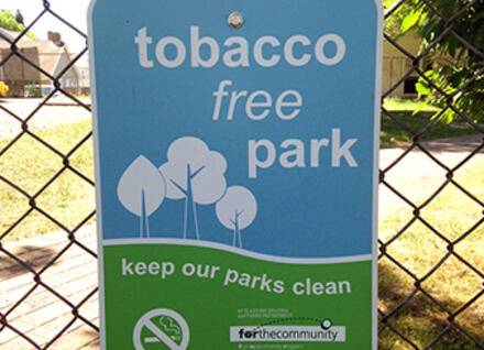 sign "tobacco free park" on fence