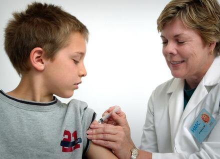 Child receiving flu vaccine Child receiving flu vaccine
