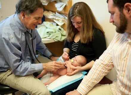 Health_Professionals-doctor with new infant and parents Health Professionals doctor
