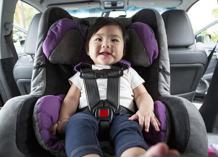 little girl in car seat