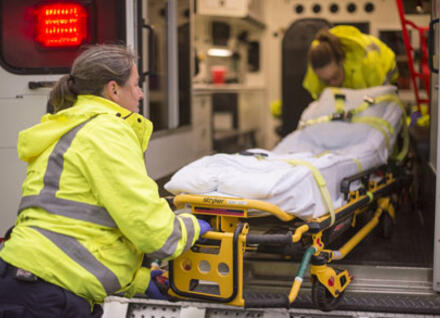 patient being taken into ambulance