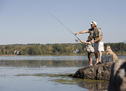 man and boy fishing