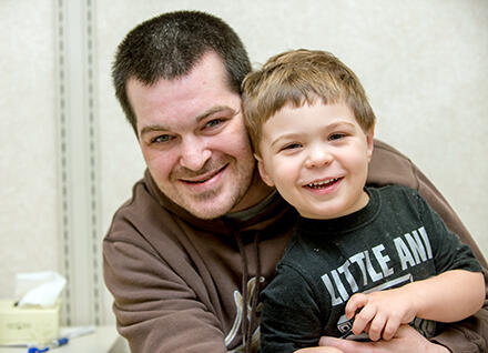 dad hugging son