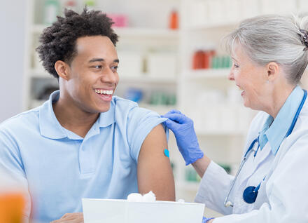 young man getting vaccination