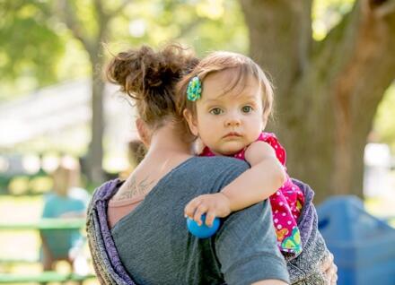 woman holding toddler