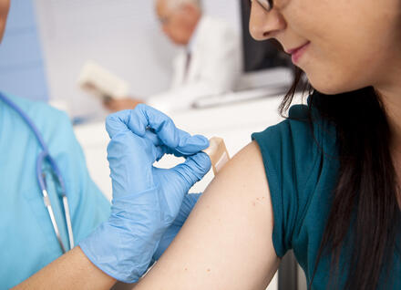 Young Woman Getting a Flu Shot Young Woman Getting a Flu Shot