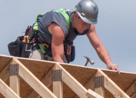 man building roof man building roof