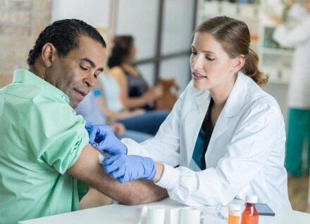 Adult male getting a vaccine Adult male getting a vaccine