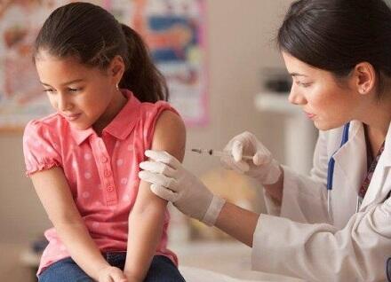 Young girl getting a vaccine Young girl getting a vaccine