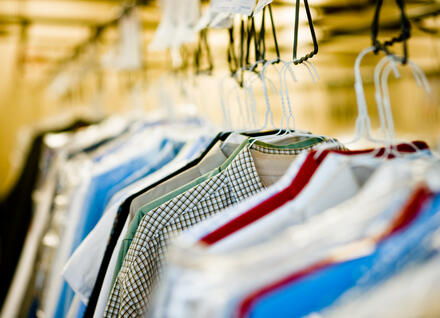 dry-cleaned clothes hanging up dry-cleaned clothes hanging up