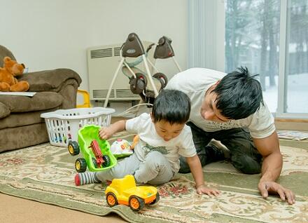 Man and boy playing