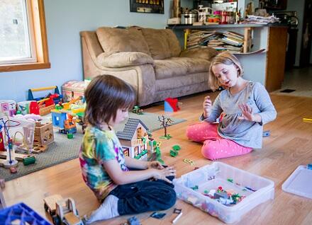 two children playing on floor