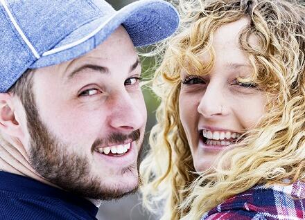 two young people, smiling