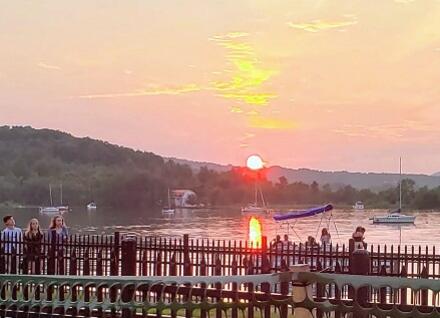 people on Memphremagog waterfront at sunset people on Memphremagog waterfront at sunset