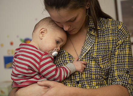 person holding baby person holding baby