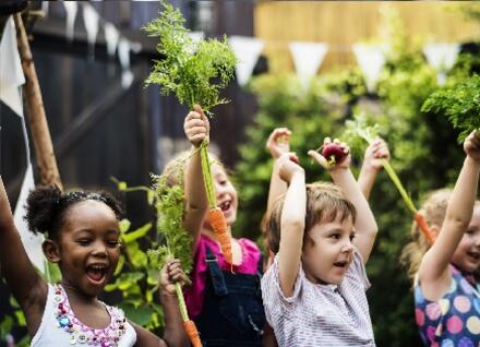 children with carrots justt harvested children with carrots just harvested