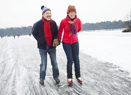 couple ice skating outdoors