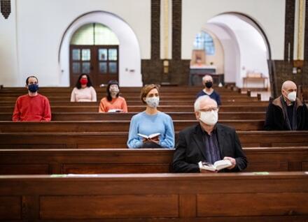 worshippers, distanced and masked