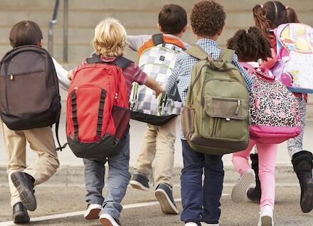 welcome kids back to an asthma friendly school kids walking toward school's entrance