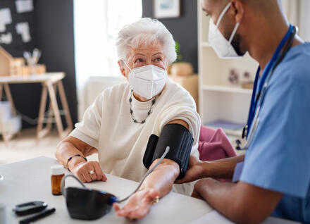 woman having blood pressure measured