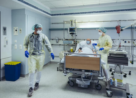 Doctors caring for patient in emergency care unit of a hospital