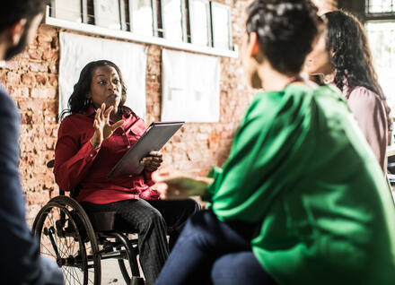 woman leads small group of people